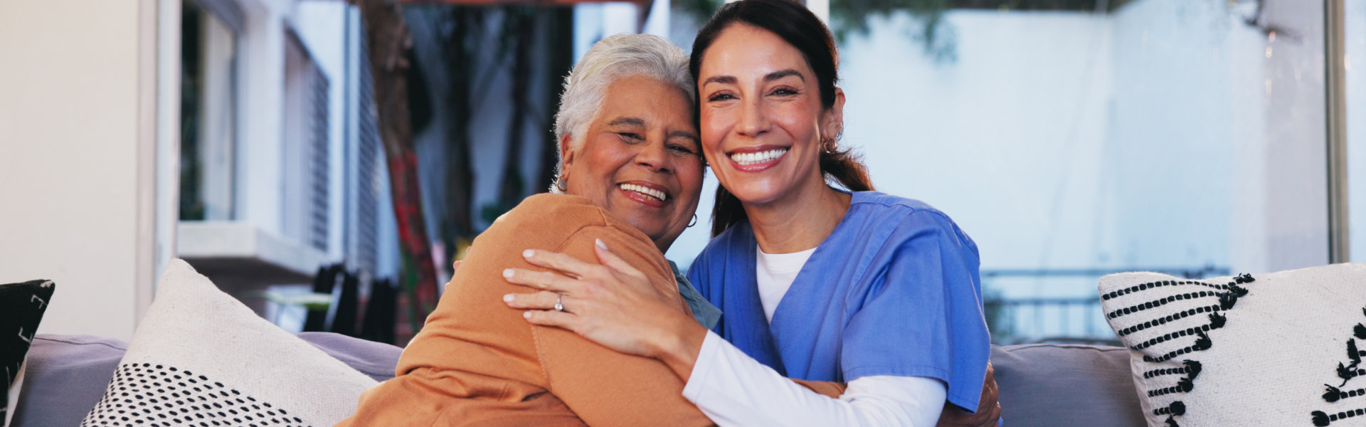 caregiver and senior smiling