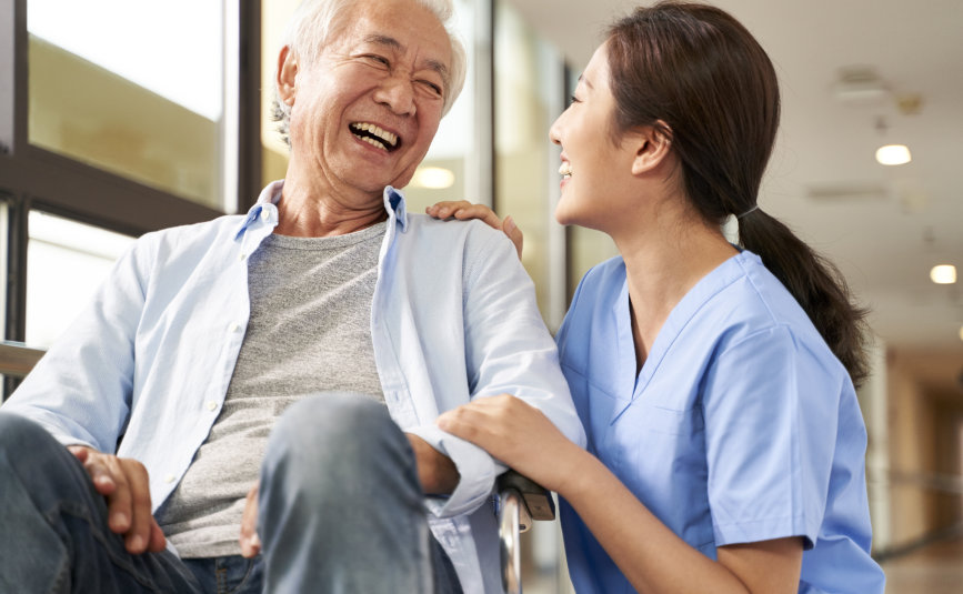 caregiver and senior smiling