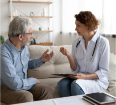 a doctor and an elderly patient engaged in a conversation